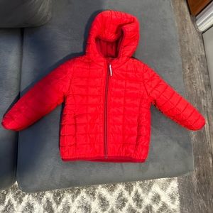 Red puffer coat